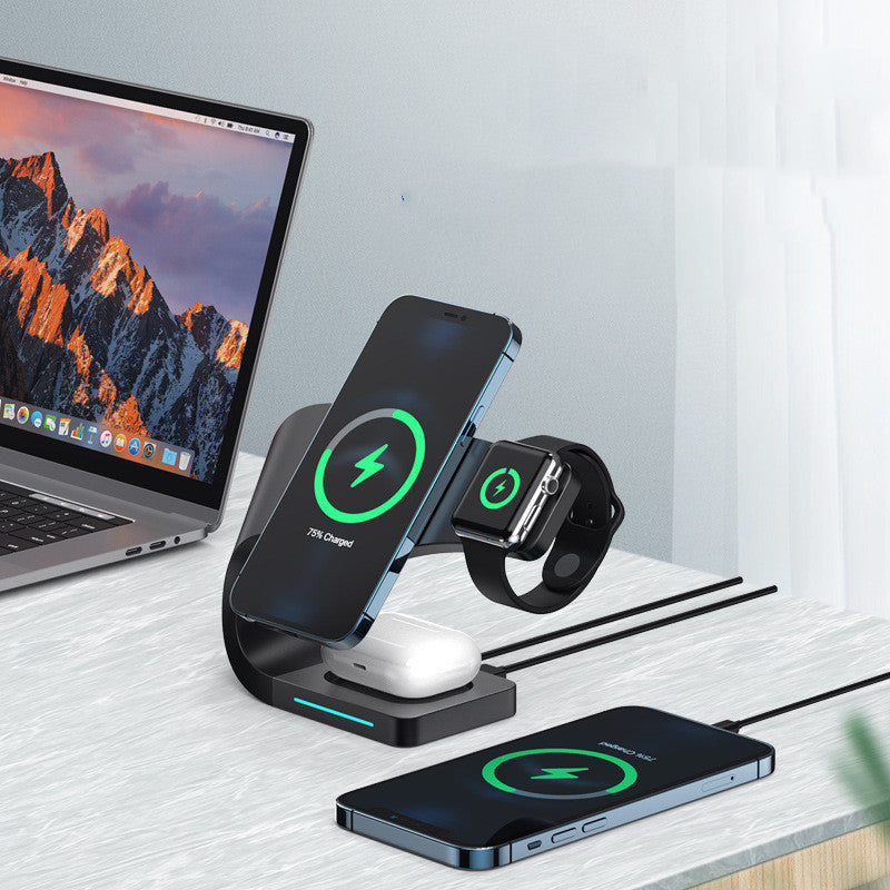 Wireless charging stand charging phone, smartwatch, and earbuds simultaneously on a modern desk.