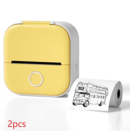 Portable mini thermal label printer in yellow color with printed label showcasing a bus design.