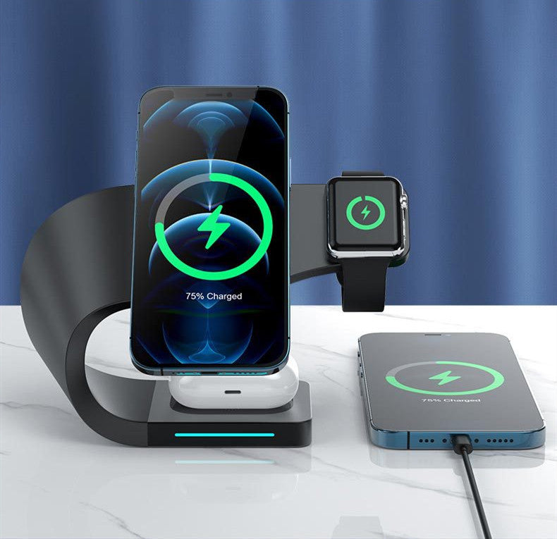 Wireless charging stand in a sleek design, charging phone, smartwatch, and earbuds simultaneously with LED indicator.